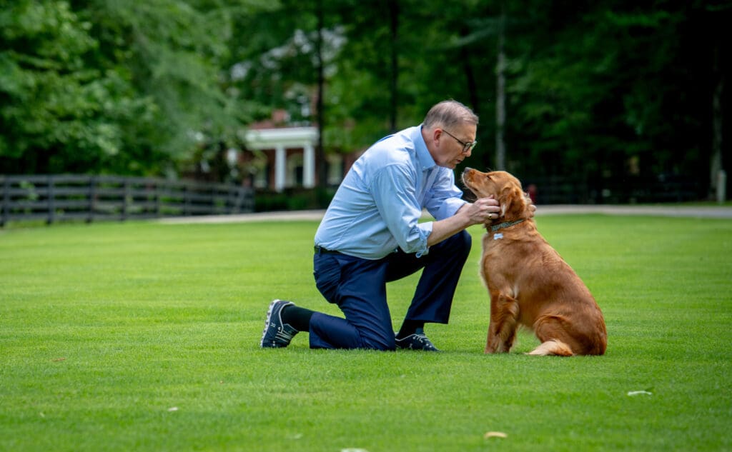 Attorney petting golden retriever